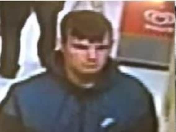 CCTV image of a man police want to speak to after an armed robbery in Fencehouses