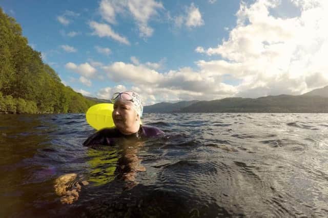 Wearing my Fausto bathing club cap on tour - swimming in Loch Lomond, Scotland, in early August.