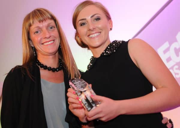 Katie Bulmer-Cooke, right, receiving her Portfolio award in 2012 from Mel Donaghue, of Barclays.