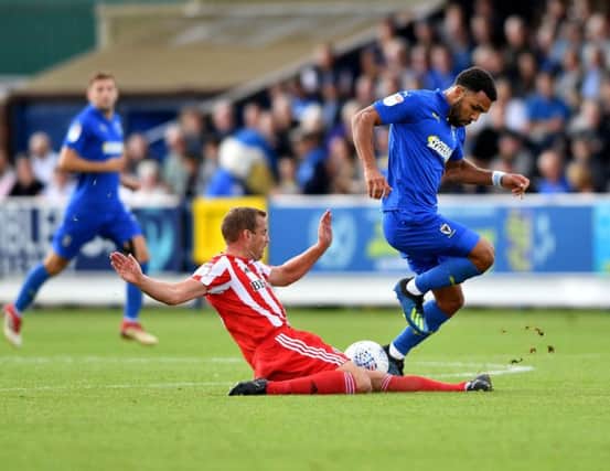 Lee Cattermole in action at AFC Wimbledon on Saturday.
