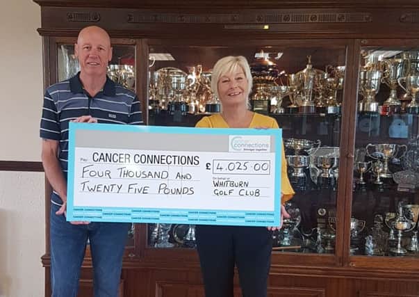 Tournament organiser Jim Simpson presents a cheque to Deborah Roberts, manager and co-founder of Cancer Connections.