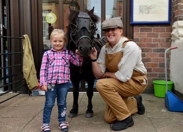 Zoe Harvey (3) from South Shields with Marley a Pit Pony and his owner Lisa Walker, outside of South Shields Museum and Art Gallery. Picture by FRANK REID