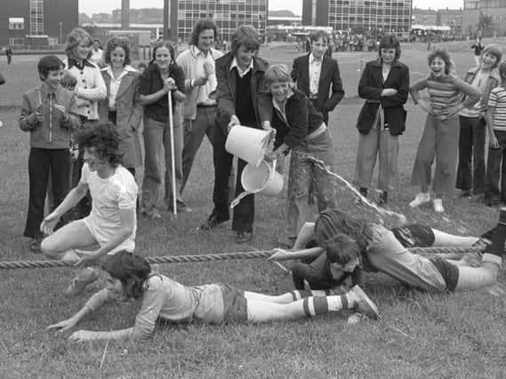 More than their spirits were dampened when the losers of the Pennywell School summer fayre tug-of-war got a soaking.