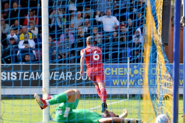Lee Cattermole celebrates his second goal at AFC Wimbledon