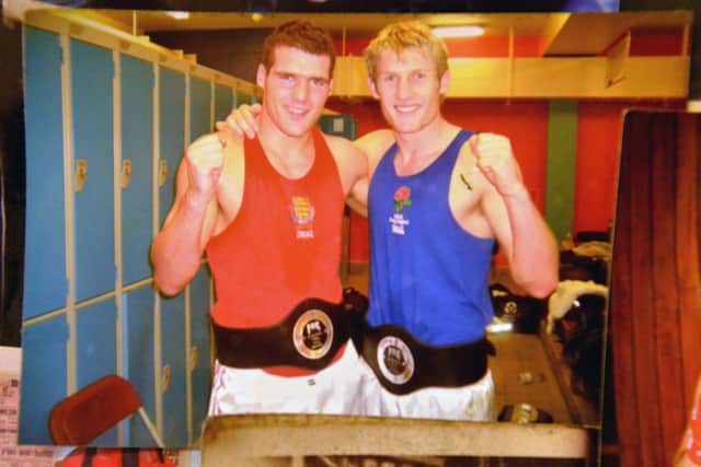 Tony Jeffries (right) photographed with former fellow Sunderland boxer David Dolan in a photograph that sits with a college of images in a frame at Sunderland ABC boxing club.