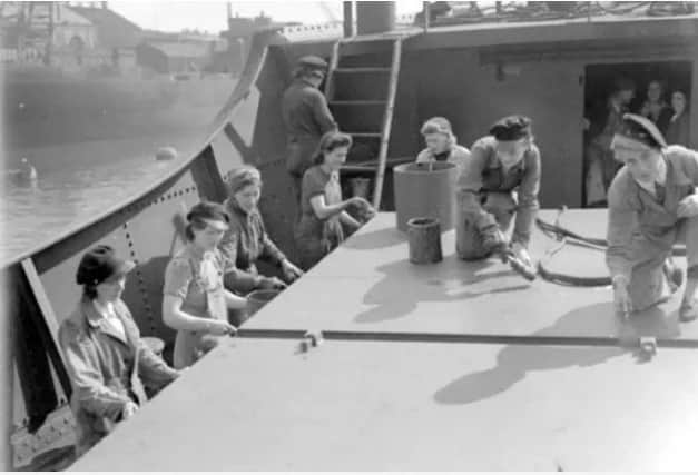 Women scrapers at a Sunderland shipyard in July 1941