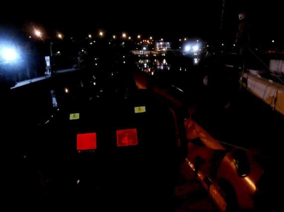 Sunderland RNLI rescue two men and a dog after boat becomes stranded. Footage from RNLI