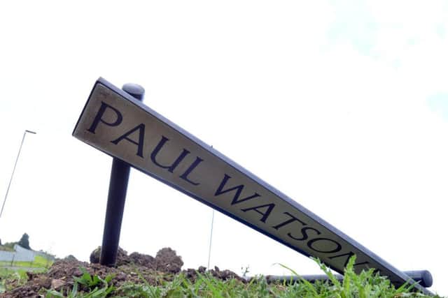 The damaged sign which was put up in tribute to former council leader Paul Watson.