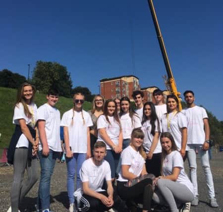 The teenagers braved  the 100ft abseil for charity.
