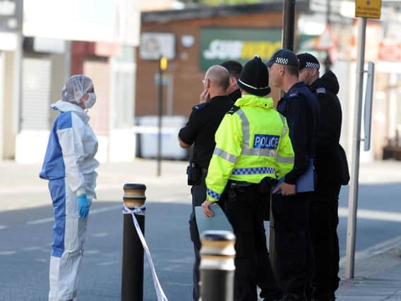 Police and forensics officers in Sea Road, Sunderland.