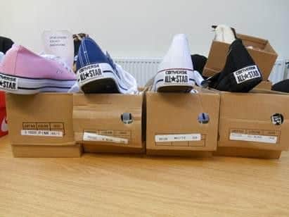 Fake branded footwear seized by trading standards officers in a raid.
