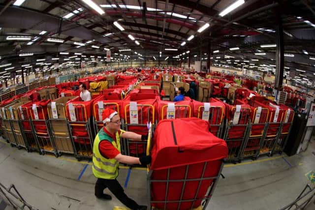 Royal Mail is recruiting seasonal staff to help sort the Christmas post. Pic: Andrew Milligan/PA Wire.