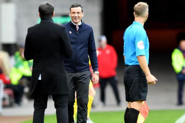Joey Barton and Jack Ross exchange words on the touchline