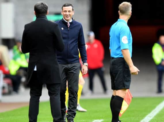 Joey Barton and Jack Ross exchange words on the touchline