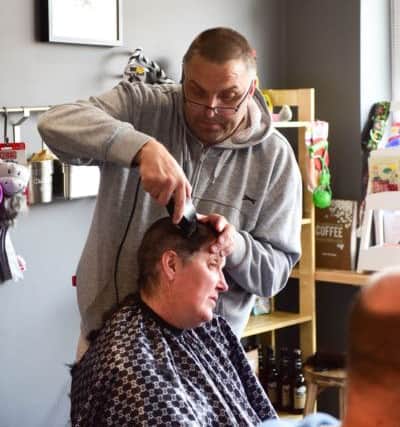 Margaret Glover, who had breast cancer 10 years ago, had her head shaved by husband Gary for the Macmillan Brave the Shave campaign at K9 Coffee House, Front Street, Fence Houses.