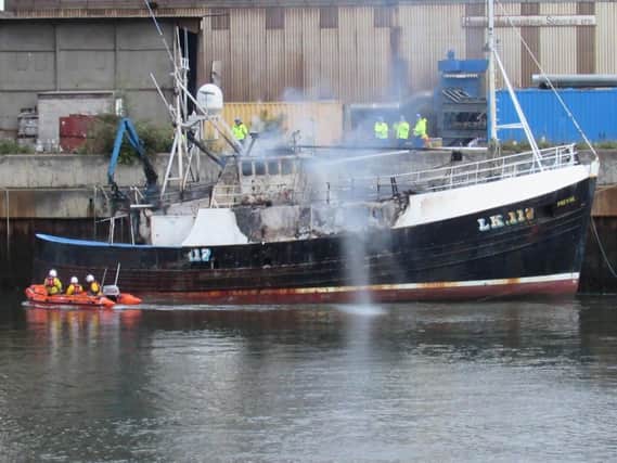 The fishing boat Prevail ablaze at Clark's Quay in Sunderland this morning. Pic: RNLI/Coastguard.