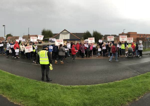 Campaigners marching against plans to turn a former GP practice in Silksworth into a YMCA.