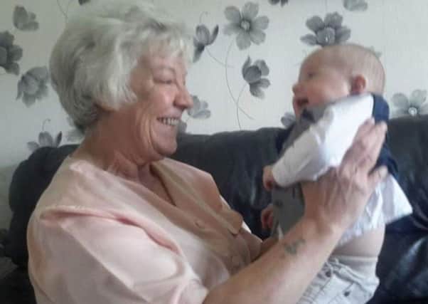 Joan Hoggett with a great grandchild.
