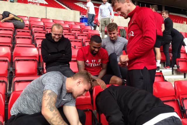 Sunderland players help out with the Stadium of Light revamp.