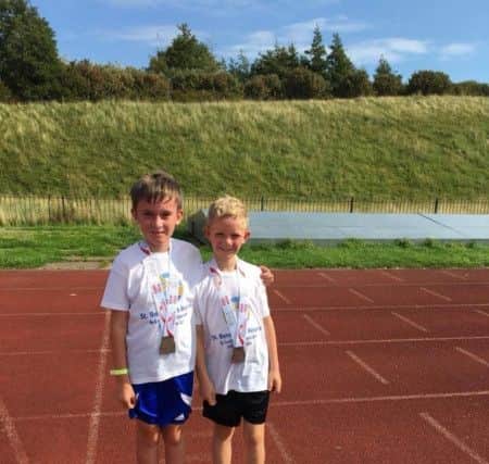 Matthew McMahon (right) and William Younger after completing their charity challenge.