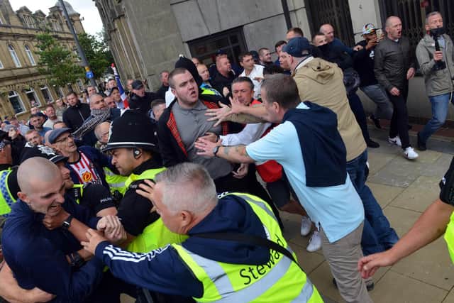 Demonstrators trying to break through police lines near Keel Square in Sunderland
