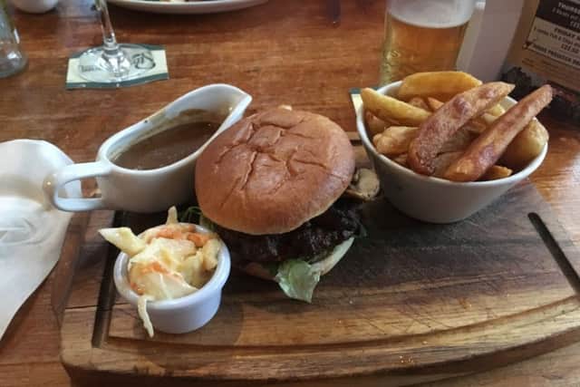 Country burger at the Three Horse Shoes with chips, slaw and peppercorn sauce.