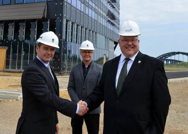 Sunderland Council leader Coun Graeme Miller, right, on the Vaux site with David Roberts of Siglion, left, and David Thompson of Tolent.