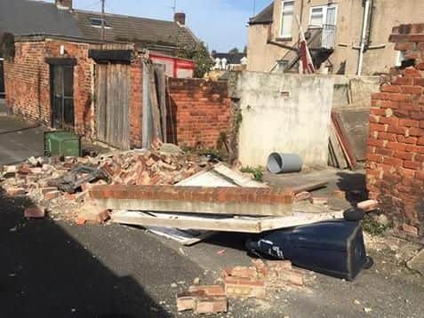 The wall has fallen down in Millfield. Picture by John Hough
