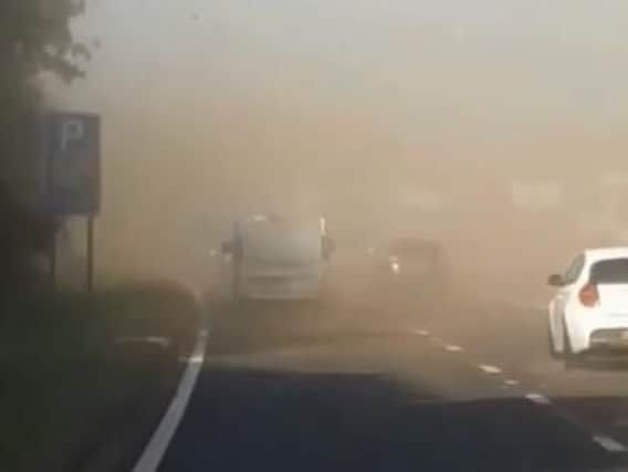 The dust cloud is making visibility difficult. Video by Jona Mcghin