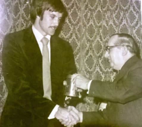 Peter Willey receiving an award from the then president Tot Lonsdale. Peter joined Harbour as an 8 year old.