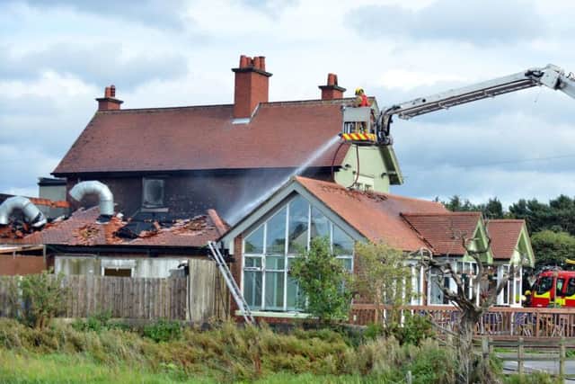 Officers put out a blaze at The Mill House in Blackfell, Washington, on September 13.