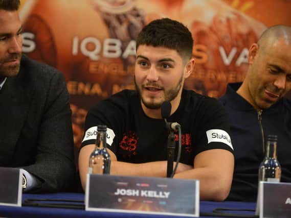 Josh Kelly is flanked by trainer Adam Booth (right) and promoter Eddie Hearn (left).