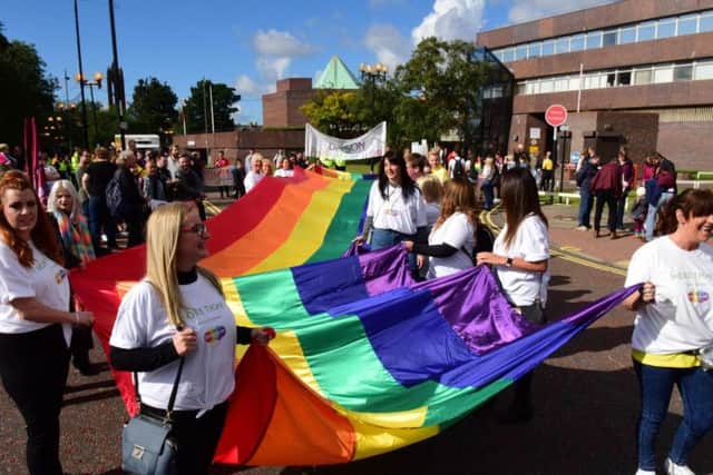 A group from insurance company More Th>n with their rainbow coloured banner for the Sunderland Pride 2018 parade