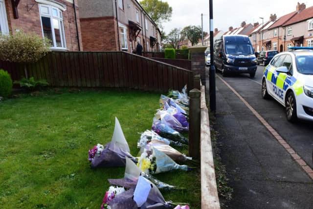Floral tributes left outside the house in Shrewsbury Crescent.