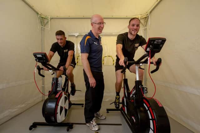 Surtees and Foot on the bikes in the heat chamber.
