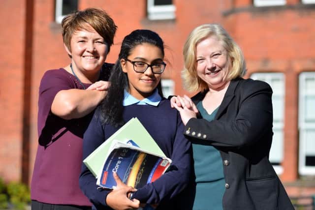 St Anthony's Girls Catholic Academy pupil Melin Sunil high GCSE grades while stuck in India. Jo Britton, Director Key Stage 3 and 4 with Helen Smith, Director of Sixth Form.