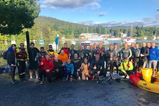 Those taking part in the Strongarm Challenge after swimming across Lake Windermere in memory of Peter Metcalfe.