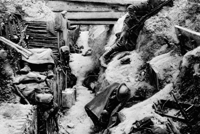 A soldier keeps watch over a trench in No Mans Land. Photo: PA.