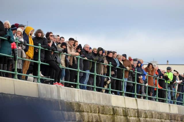 Crowds line the seafront