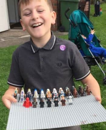 Blake Simpson with some of the Lego donated by a police charity.