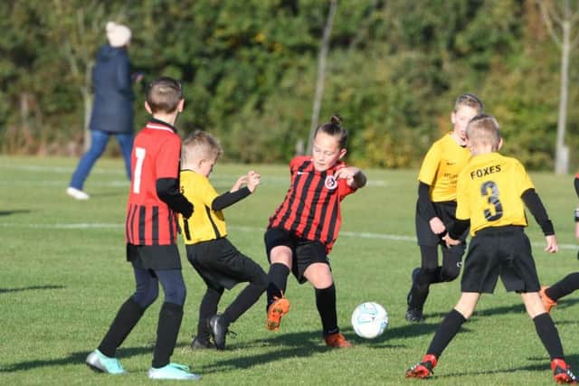 Crook Town Youth FC under 9s, yellow, versus Washington Athletic Barca u9s, red.