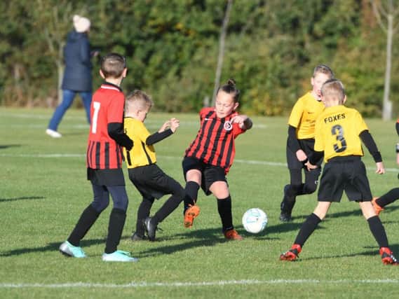 Crook Town Youth FC under 9s, yellow, versus Washington Athletic Barca u9s, red.