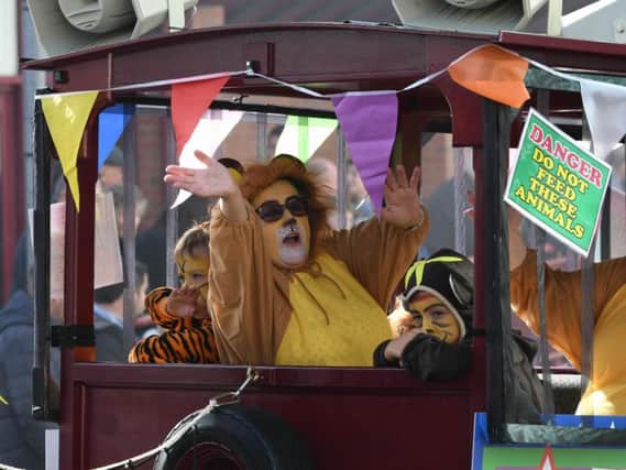 The circus animals wave to the crowds