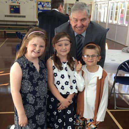Coun Barry Curran with some of the children.