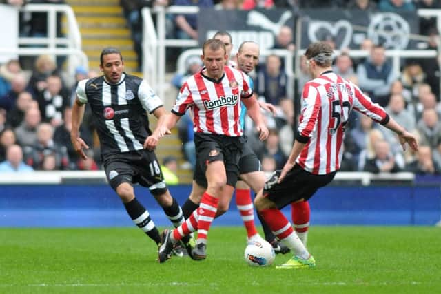 Cattermole and Bendtner in action against Newcastle.