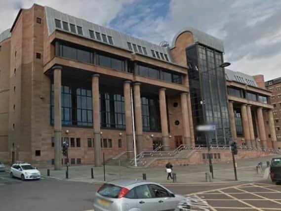 The trial is being heard at Newcastle Crown Court