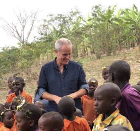 Phil Vickery with children during the trip to Uganda.