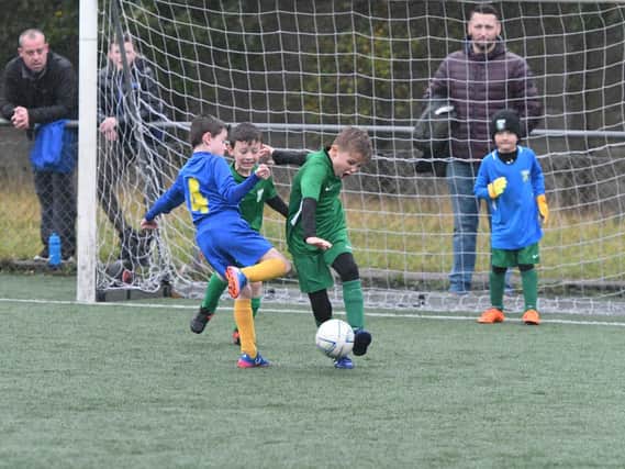 Russell Foster action at Durham City AFC on Saturday as Easington Colliery, in green, take on Hetton Juniors Milan, in blue.