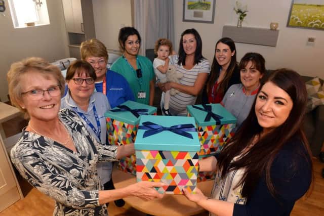 Sunderland Royal Hospital Maternity department consultant Helen Cameron, left, receives donation boxes from Steph Archbold.
