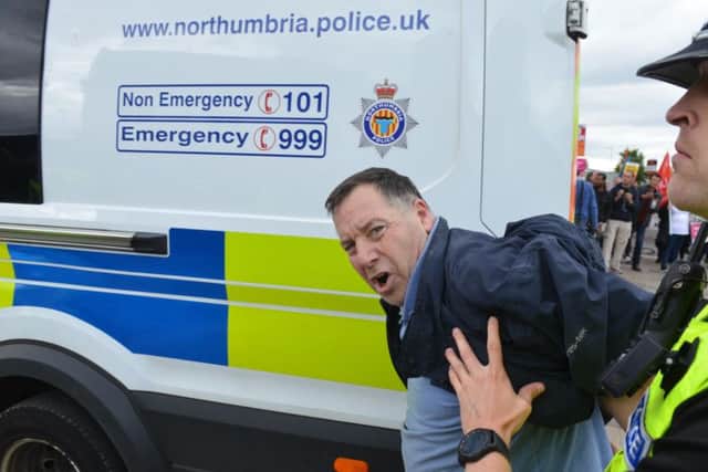 Thomas Allen being led away by police during the demos in Sunderland